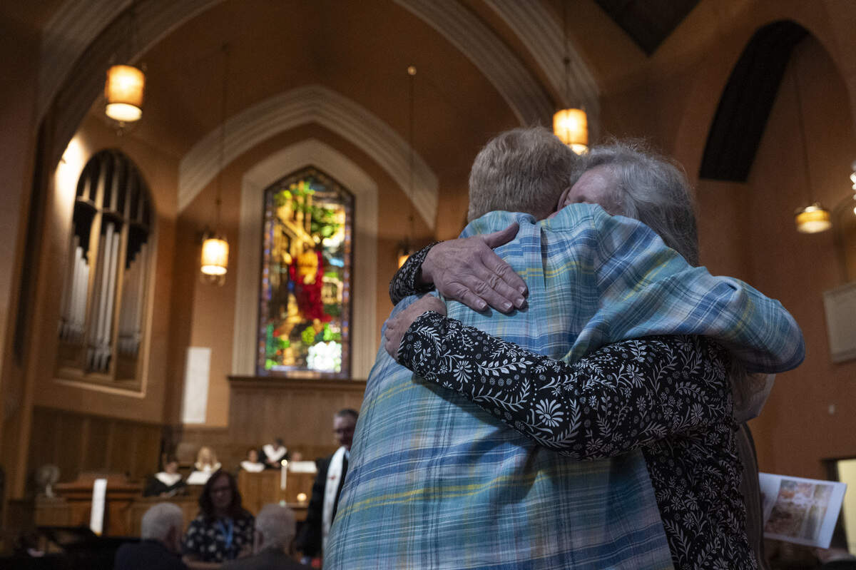 Raymond Graetz hugs Barbara Renzi before the final service of Pioneer Congregational United Church of Christ at their church on L Street in Sacramento on Sunday, May 31.